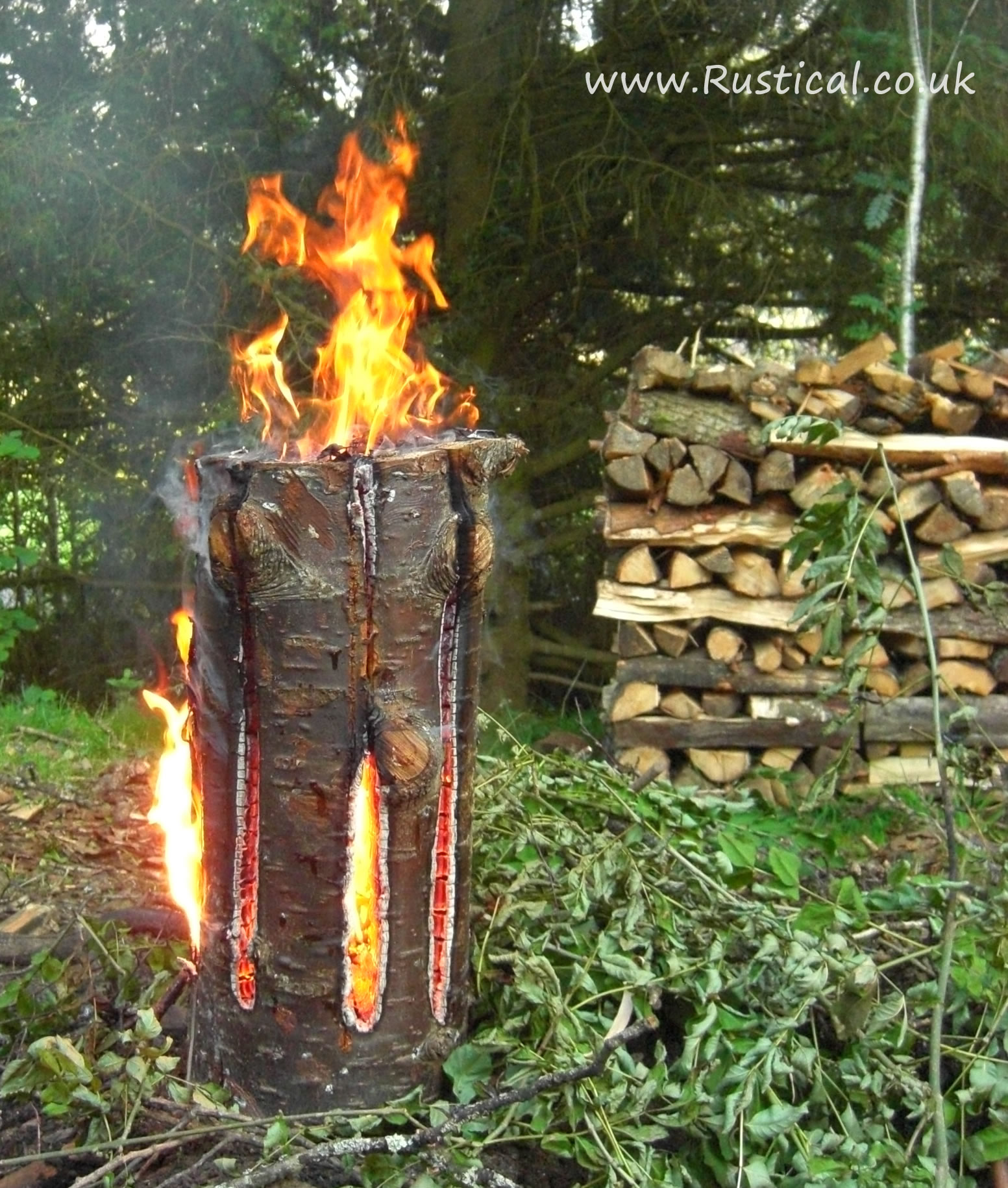A lit 'Fire Dragon' Swedish Candle campfire alternative