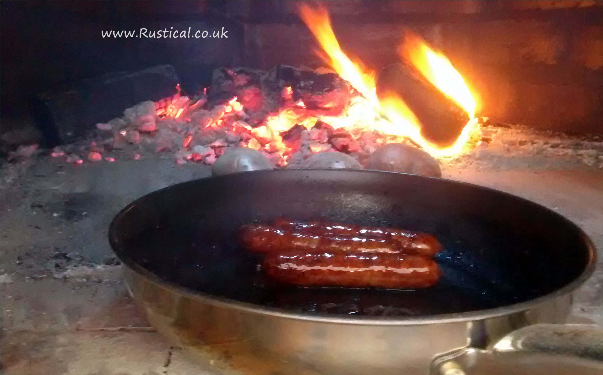 Cooking Sausages in a wood fired oven